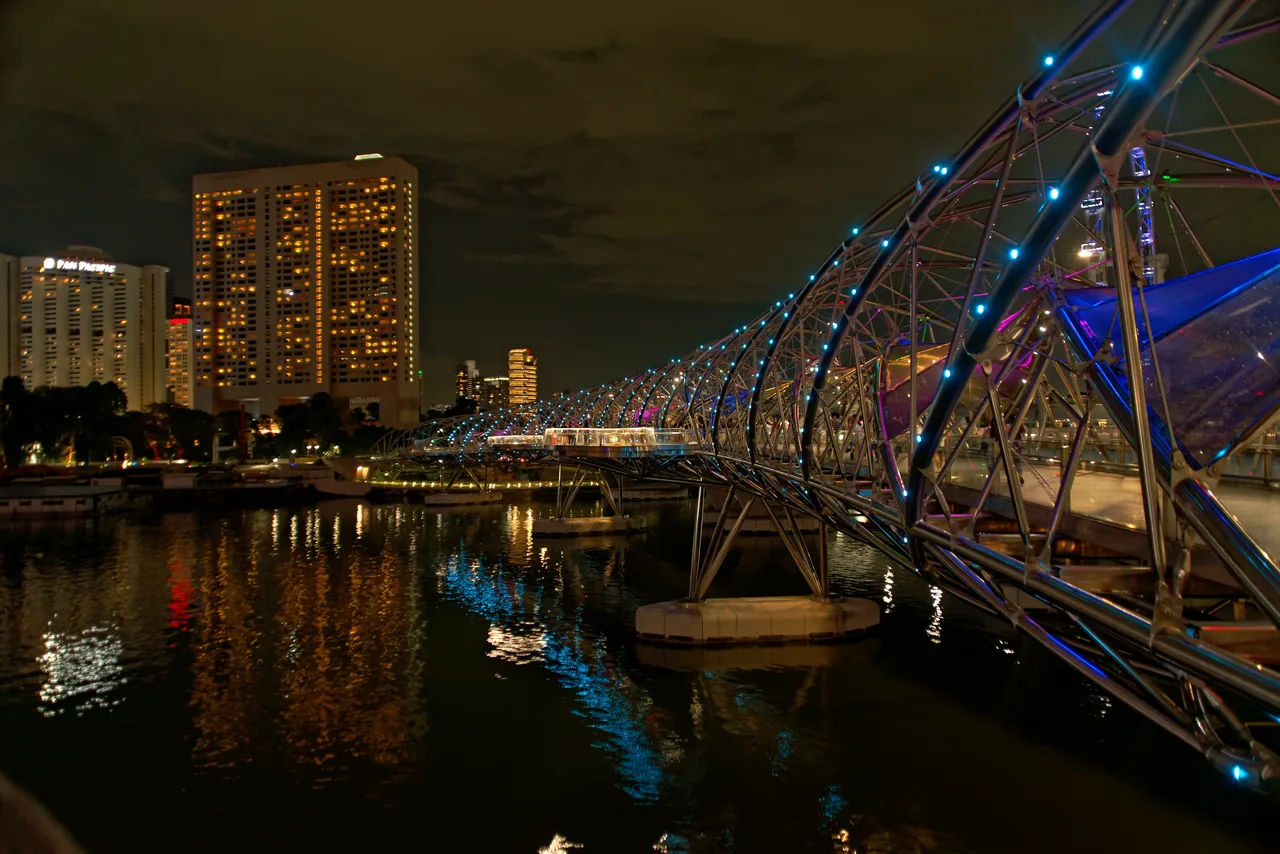 The Helix Bridge in Singapore lit up at night The Helix Bridge in Singapore lit up at night