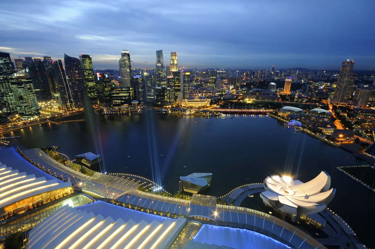 The Marina Bay waterfront and Singapore skyline at dusk