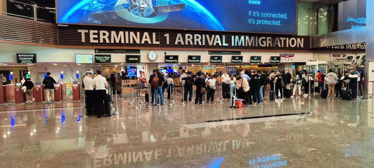 Arrival immigration hall at Changi Airport Terminal 1, with automated clearance lanes on the left Arrival immigration hall at Changi Airport Terminal 1, with automated clearance lanes on the left
