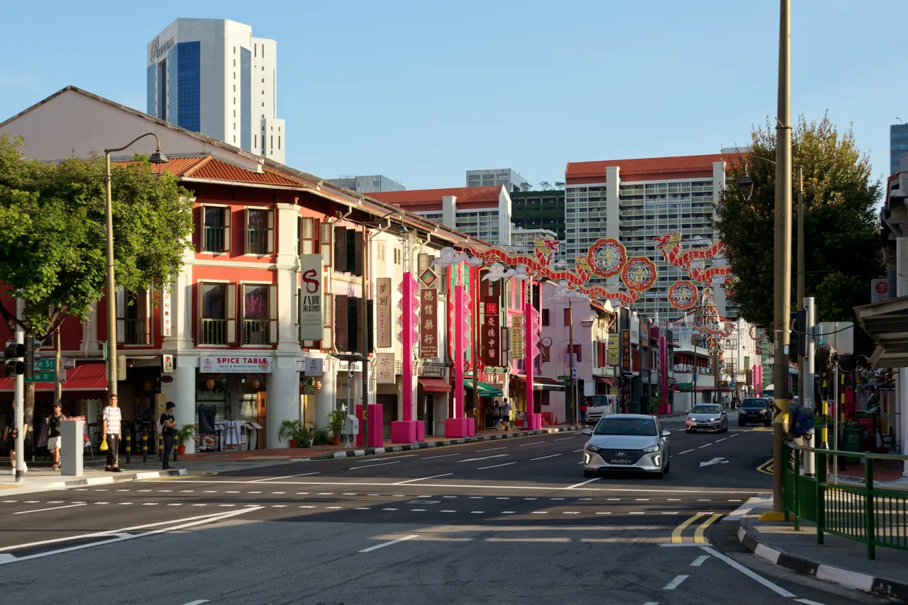 South Bridge Road in Singapore's Chinatown with red and gold Chinese New Year decorations strung across the road above the shophouses