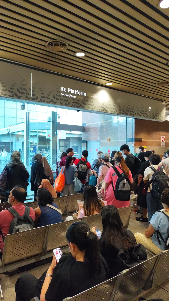 Passengers filling the holding area at JB Sentral while waiting to board the border shuttle
